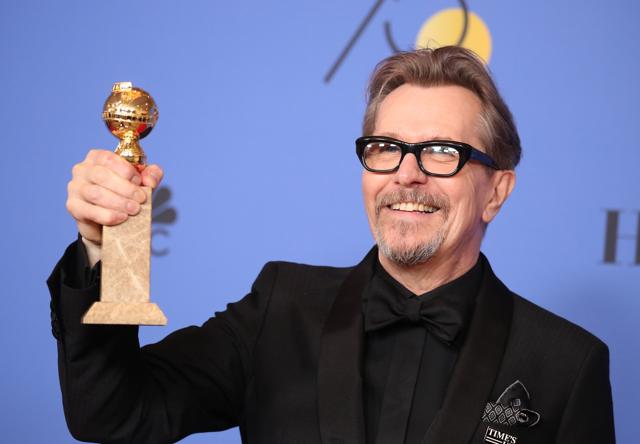 Gary Oldman poses backstage with his award for Best Performance by an Actor in a Motion Picture - Drama for Darkest Hour. (REUTERS)