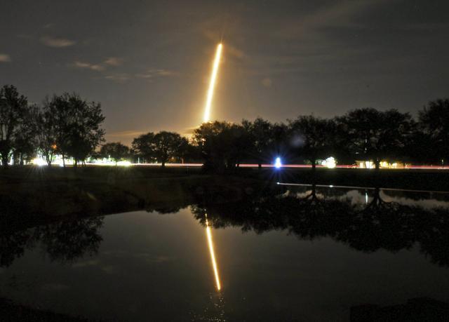 In this image made with a long exposure, the SpaceX Falcon 9 rocket launches from Cape Canaveral Air Force Station. (AP Photo)