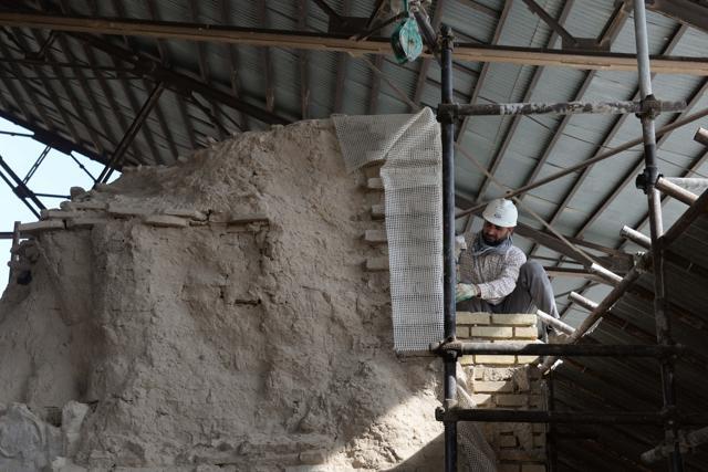An Afghan labourer working amidst scaffolding for the ongoing conservation work at the ninth-century mosque. (AFP) An Afghan labourer working amidst scaffolding for the ongoing conservation work at the ninth-century mosque. (AFP)