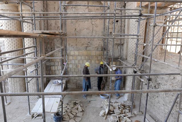 Afghan labourers working amidst scaffolding. (AFP) Afghan labourers working amidst scaffolding. (AFP)