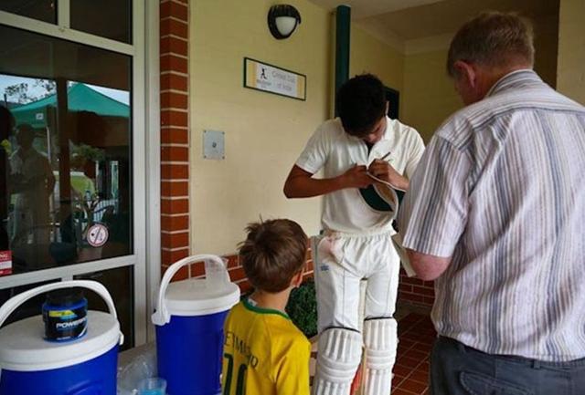 Arjun Tendulkar signs an autograph for a young fan at the Don Bradman Oval. (Twitter) Arjun Tendulkar signs an autograph for a young fan at the Don Bradman Oval. (Twitter)