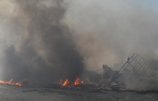 A neighbouring cattle shed also caught fire but the animals were rescued in time. (Prabhakar Sharma/HT ) A neighbouring cattle shed also caught fire but the animals were rescued in time. (Prabhakar Sharma/HT )