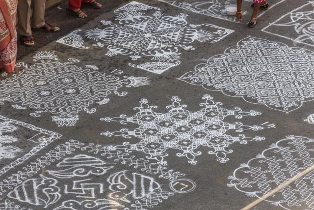 Indian traditional kolam or rangoli is drawn using white colored rice during Pongal. (Shutterstock)