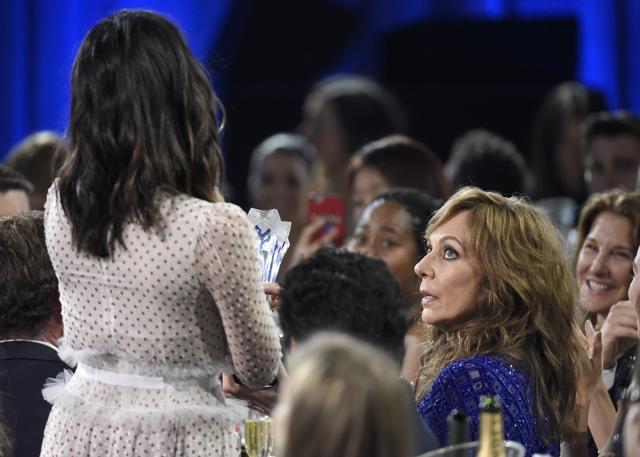 Olivia Munn, left, jokingly presents the award for mother of the year to Allison Janney for I, Tonya in the audience at the 23rd annual Critics' Choice Awards. (Chris Pizzello/Invision/AP)