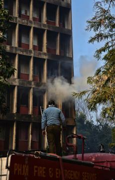 Smoke billowing out of the gutted room (No. 34) on the second floor of girls’ hostel number 3 — Sarojini Naidu Hall — at Panjab University in Chandigarh on Saturday. (HT Photo) Smoke billowing out of the gutted room (No. 34) on the second floor of girls’ hostel number 3 — Sarojini Naidu Hall — at Panjab University in Chandigarh on Saturday. (HT Photo)
