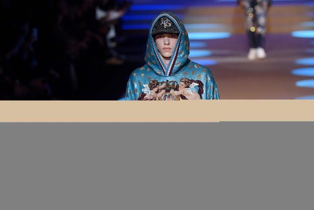A model presents a creation for fashion house Dolce &amp; Gabbana during the Men's Fall/Winter 2019 fashion shows in Milan, on January 13, 2018. (AFP/Marco BERTORELLO)