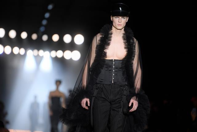 A model presents a creation for fashion house Moschino during the Men's Fall/Winter 2019 fashion shows in Milan. (AFP/Marco BERTORELLO)