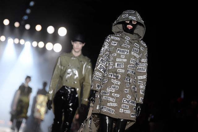 A model presents a creation for fashion house Moschino during the Men's Fall/Winter 2019 fashion shows in Milan. (AFP/Marco BERTORELLO)