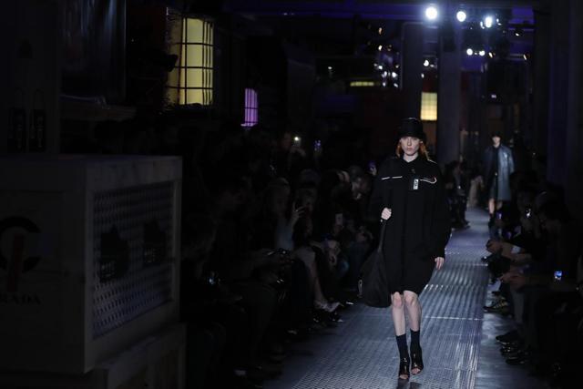 Prada employs her favoured material, black nylon, in her pieces for the next cold weather season, padding them and applying them in protective layers. (AP) Prada employs her favoured material, black nylon, in her pieces for the next cold weather season, padding them and applying them in protective layers. (AP)