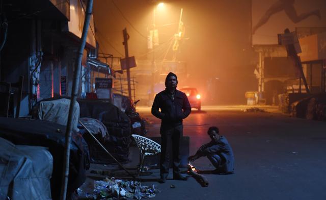 A watchman and a destitute at Aminabad area of Lucknow. (Subhankar Chakraborty/HT Photo) A watchman and a destitute at Aminabad area of Lucknow. (Subhankar Chakraborty/HT Photo)