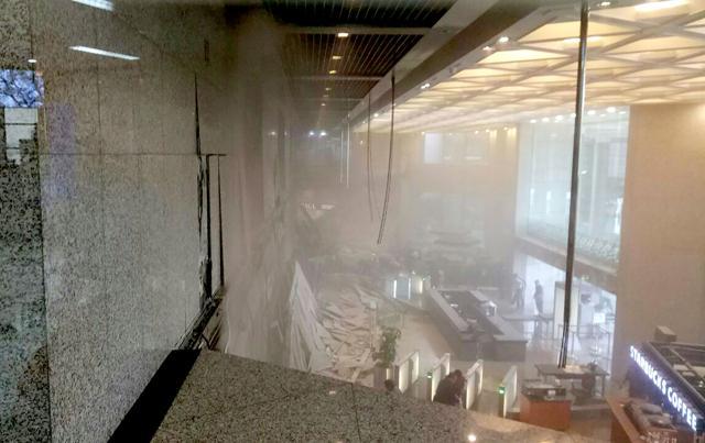 This photo received from Amailia Putri Hasniawati via WhatApp shows dust still clouding the lobby after an internal balcony collapsed at Indonesia's stock exchange in Jakarta on January 15, 2018. (AFP) This photo received from Amailia Putri Hasniawati via WhatApp shows dust still clouding the lobby after an internal balcony collapsed at Indonesia's stock exchange in Jakarta on January 15, 2018. (AFP)