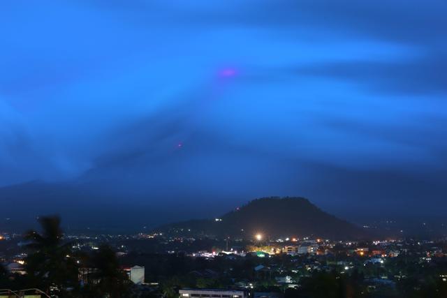 The glow (at top) of lava from the cloud-covered Mayon volcano as it erupts. (AFP Photo) The glow (at top) of lava from the cloud-covered Mayon volcano as it erupts. (AFP Photo)