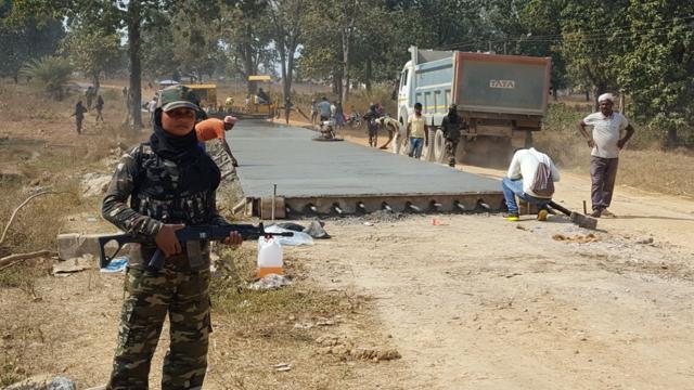 A woman commando of Chhattisgarh Police stands guard at a road building site in Sukma. (HT PHOTO) A woman commando of Chhattisgarh Police stands guard at a road building site in Sukma. (HT PHOTO)