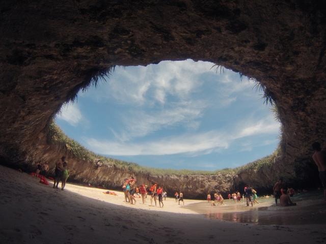 The beach can be reached only by swimming or kayaking in a water tunnel. (Shutterstock) The beach can be reached only by swimming or kayaking in a water tunnel. (Shutterstock)
