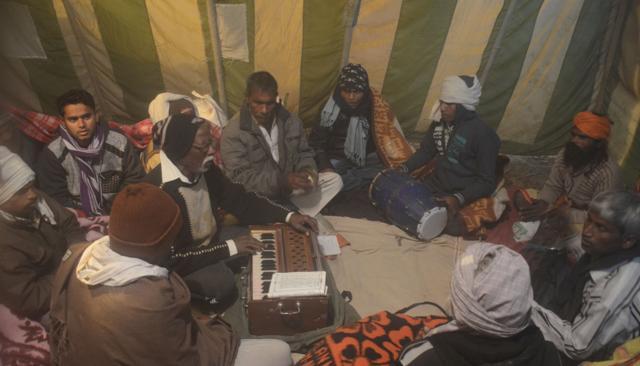 Pilgrims from Jaunpur, Faizabad and other districts singing devotional songs to the accompaniment of music in mela area. (Anil Kumar Maurya/HT)