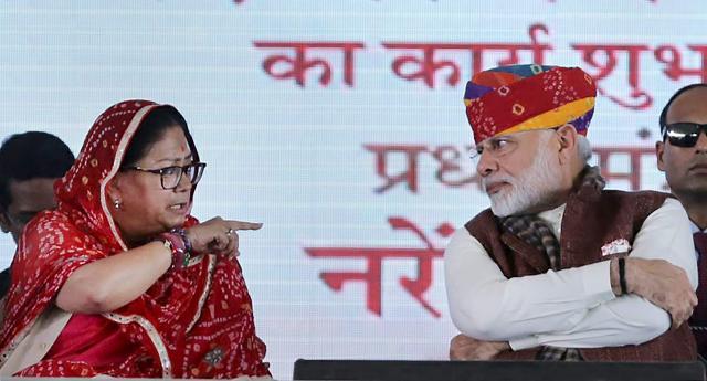 Prime Minister Narendra Modi and Rajasthan Chief Minister Vasundhara Raje at a public rally in Barmer. (PTI) Prime Minister Narendra Modi and Rajasthan Chief Minister Vasundhara Raje at a public rally in Barmer. (PTI)