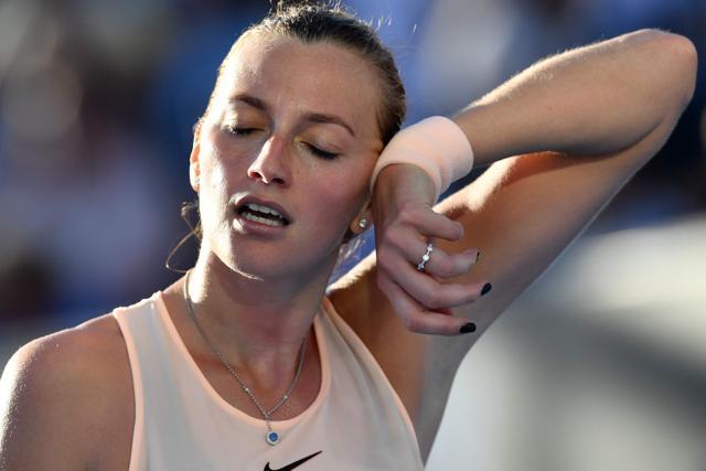Petra Kvitova reacts during their women's singles first round match against Andrea Petkovic. (AFP)