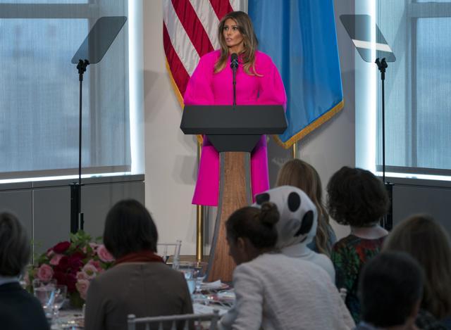 Melania wore a bright pink belted Del Pozo dress with dramatic leg of mutton sleeves for an address at the United Nations on 20 September, 2017. (AP) Melania wore a bright pink belted Del Pozo dress with dramatic leg of mutton sleeves for an address at the United Nations on 20 September, 2017. (AP)