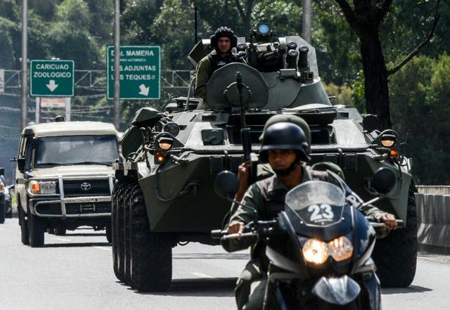 A armoured tank from the Venezuelan army drives along a highway in Caracas as an operation to capture Oscar Perez. (AFP Photo) A armoured tank from the Venezuelan army drives along a highway in Caracas as an operation to capture Oscar Perez. (AFP Photo)