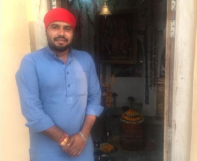 The priest at the Katas Raj temple complex. (HT Photo) The priest at the Katas Raj temple complex. (HT Photo)