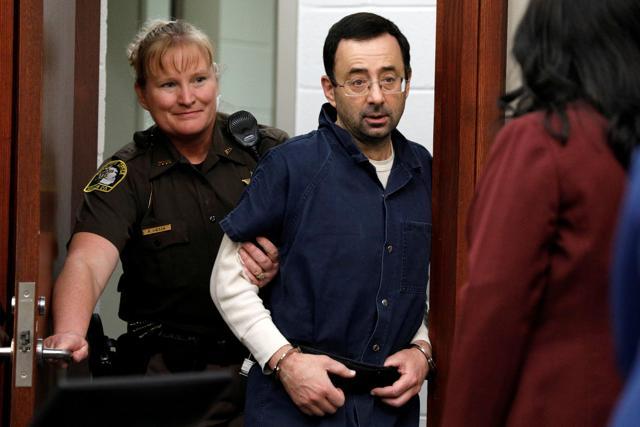 Larry Nassar, a former team USA Gymnastics doctor, who pleaded guilty in November 2017 to sexual assault charges, is escorted into the courtroom during his sentencing hearing in Lansing, Michigan. (REUTERS) Larry Nassar, a former team USA Gymnastics doctor, who pleaded guilty in November 2017 to sexual assault charges, is escorted into the courtroom during his sentencing hearing in Lansing, Michigan. (REUTERS)