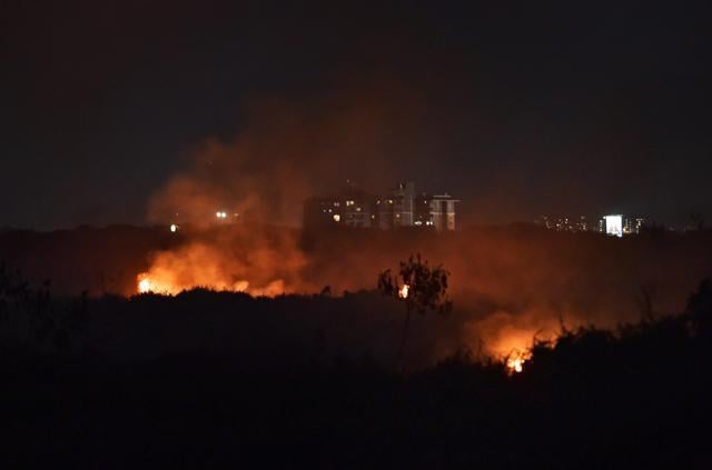 Bengaluru : The fire broke out at Bengaluru's Bellandur lake, which is known for toxic froth, on Friday. (PTI) Bengaluru : The fire broke out at Bengaluru's Bellandur lake, which is known for toxic froth, on Friday. (PTI)