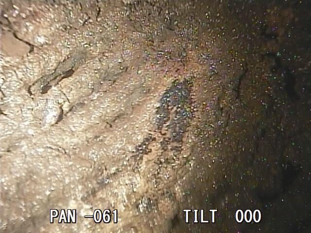 A photo taken by a robotic probe provided by the International Research Institute for Nuclear Decommissioning on January 19, 2018 shows part of a grated platform that broke and fell from a structure below the core of Unit 2 reactor's primary containment vessel coated with what could be melted fuel or structure inside the Fukushima nuclear plant. (AP) A photo taken by a robotic probe provided by the International Research Institute for Nuclear Decommissioning on January 19, 2018 shows part of a grated platform that broke and fell from a structure below the core of Unit 2 reactor's primary containment vessel coated with what could be melted fuel or structure inside the Fukushima nuclear plant. (AP)