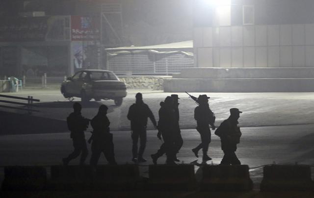 Security forces walk towards the Intercontinental Hotel. (AP Photo) Security forces walk towards the Intercontinental Hotel. (AP Photo)