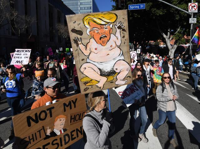 Protesters, part of a 500,000 strong crowd, during the Women's Rally on the one-year anniversary of the first Women's March, when millions marched around the world to protest US President Donald Trump's inauguration, in Los Angeles, California on January 20, 2018. (AFP) Protesters, part of a 500,000 strong crowd, during the Women's Rally on the one-year anniversary of the first Women's March, when millions marched around the world to protest US President Donald Trump's inauguration, in Los Angeles, California on January 20, 2018. (AFP)