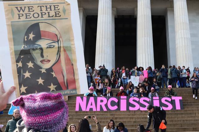 People gather at the Lincoln Memorial reflecting pool to rally before the Women's March. (AFP Photo) People gather at the Lincoln Memorial reflecting pool to rally before the Women's March. (AFP Photo)