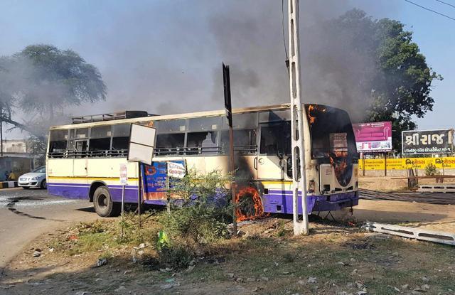 Gandhinagar: Members of Karni Sena set fire to a public transport to protest against the release of Padmaavat in Gandhinagar on Saturday. (PTI) Gandhinagar: Members of Karni Sena set fire to a public transport to protest against the release of Padmaavat in Gandhinagar on Saturday. (PTI)