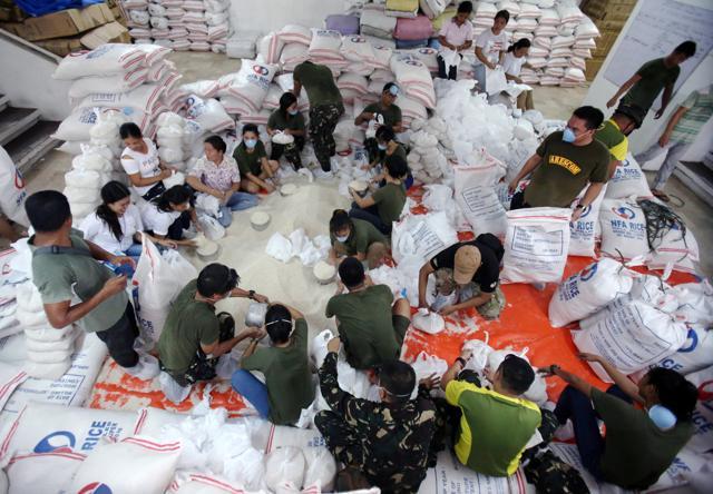 Soldiers and government employees prepares relief goods to be distribute to the evacuees who are affected in the minor eruption of Mayon Volcano in Albay province. (Reuters File Photo) Soldiers and government employees prepares relief goods to be distribute to the evacuees who are affected in the minor eruption of Mayon Volcano in Albay province. (Reuters File Photo)
