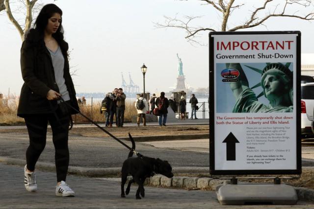 People walk near the Liberty State ferry terminal at Battery Park on Sunday in New York City. (AFP) People walk near the Liberty State ferry terminal at Battery Park on Sunday in New York City. (AFP)