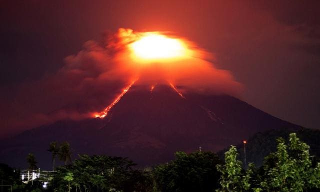 Lava cascades down the slopes of Mayon volcano as seen from Legazpi city, Albay province, around 340 kilometres southeast of Manila, Philippines. (AP File Photo) Lava cascades down the slopes of Mayon volcano as seen from Legazpi city, Albay province, around 340 kilometres southeast of Manila, Philippines. (AP File Photo)