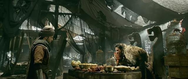 Bhansali’s Khilji, played by Ranveer Singh, has kohl-rimmed hungry eyes, a scarred face, a gym-toned body, wears furs when he is not bare-chested and rips meat off the bone with his teeth. (Movie still)