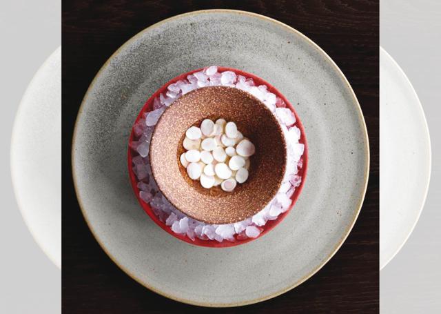 Noma Australia serves unripe macadamia nuts with spanner crab broth and a dash of rose oil (Vincent Long) Noma Australia serves unripe macadamia nuts with spanner crab broth and a dash of rose oil (Vincent Long)