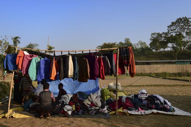 A Rohingya refugee sells winter clothes at Balukhali refugee camp in Bangladesh's Ukhia district on January 24, 2018. (AFP)