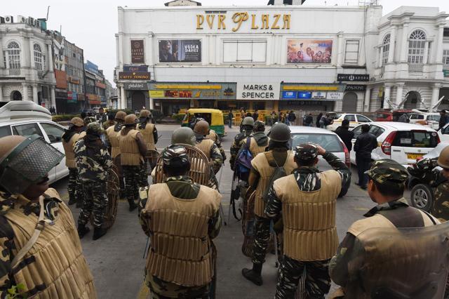 Police personnel stand guard at the entrance of a cinema hall scheduled to screen Padmaavat in New Delhi on Thursday. (AFP) Police personnel stand guard at the entrance of a cinema hall scheduled to screen Padmaavat in New Delhi on Thursday. (AFP)