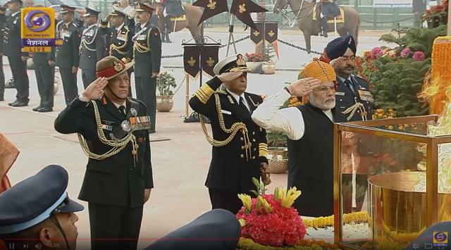 Prime Minister Narendra Modi with heads of (from left) Indian Army, General Bipin Rawat, Indian Navy, Admiral Sunil Lanba, and Indian Air Force, Air Chief Marshal Birender Singh Dhanoa, at Amar Jawan Jyoti in New Delhi on Friday. (Doordarshan)