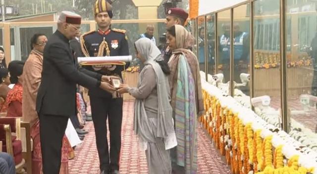 President Ram Nath Kovind present Ashoka Chakra to the wife of Late Air Force Commando JP Nirala, who lost his life in Bandipora encounter, on Friday. (ANI Twitter) President Ram Nath Kovind present Ashoka Chakra to the wife of Late Air Force Commando JP Nirala, who lost his life in Bandipora encounter, on Friday. (ANI Twitter)