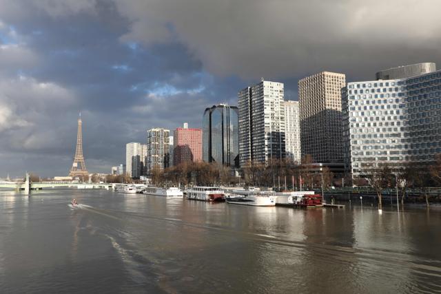 A picture taken on January 26, 2018, shows the flooded banks of the river Seine and the Beaugrenelle area and Eiffel Tower in the backround in Paris. (AFP)