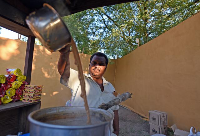 The play gets its name from an extra-strong tea preparation very popular in Ahmedabad. At the venue, the drama begins at the main gate. The audience must make its way through a maze lined with garba dancers and chai stalls. (Satyabrata Tripathy / HT Photo)