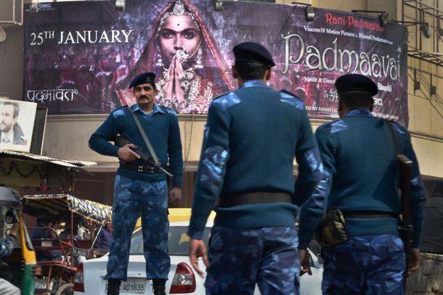 Security personnel guard outside a cinema house after release of the film Padmaavat in Delhi on Thursday. (PTI) Security personnel guard outside a cinema house after release of the film Padmaavat in Delhi on Thursday. (PTI)