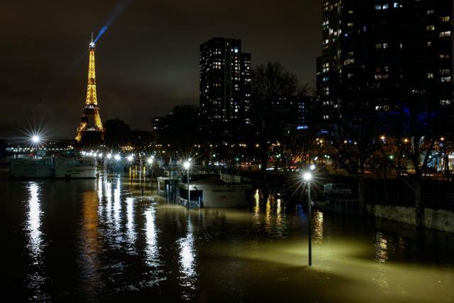 A picture taken late on January 28, 2018 in Paris shows the flooded Quai de Grenelle by the banks of the Seine river. (AFP) A picture taken late on January 28, 2018 in Paris shows the flooded Quai de Grenelle by the banks of the Seine river. (AFP)