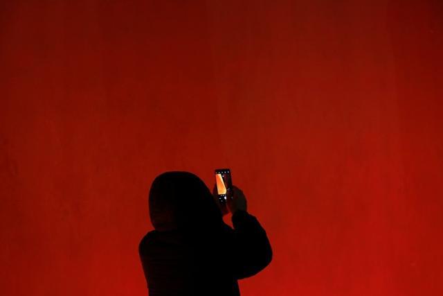 A man takes pictures of the super blue moon above the Forbidden City in Beijing, China. (Reuters) A man takes pictures of the super blue moon above the Forbidden City in Beijing, China. (Reuters)