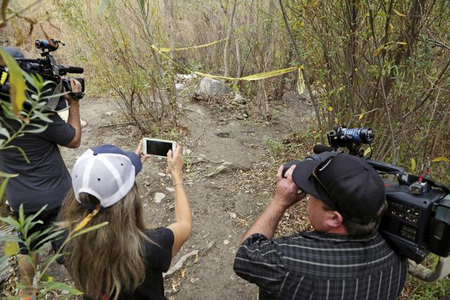 Journalists view the spot where Mark Salling, who played Noah "Puck" Puckerman in the hit musical-comedy Glee, was found dead in a remote area of Big Tujunga Canyon in the Sunland-Tujunga area of Los Angeles, Tuesday, Jan. 30, 2018. (AP)