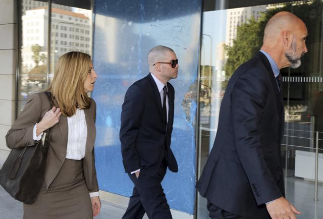 Former Glee actor Mark Salling, center, arrives at federal court in Los Angeles on Monday, Dec. 18, 2017. Salling had pleaded guilty to possession of child pornography. (AP)