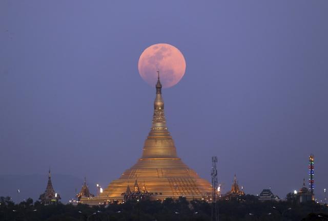 The moon rises behind the Uppatasanti Pagoda seen from Naypyitaw, Myanmar, Wednesday. (AP Photo) The moon rises behind the Uppatasanti Pagoda seen from Naypyitaw, Myanmar, Wednesday. (AP Photo)
