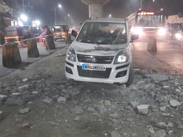 The car was passing under the flyover when parts of the flyover landed on it on Wednesday night. (Praful Gangurde) The car was passing under the flyover when parts of the flyover landed on it on Wednesday night. (Praful Gangurde)