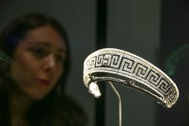 A museum employee poses next to a diamond and pearl Cartier tiara saved from the Lusitania. (AFP) A museum employee poses next to a diamond and pearl Cartier tiara saved from the Lusitania. (AFP)